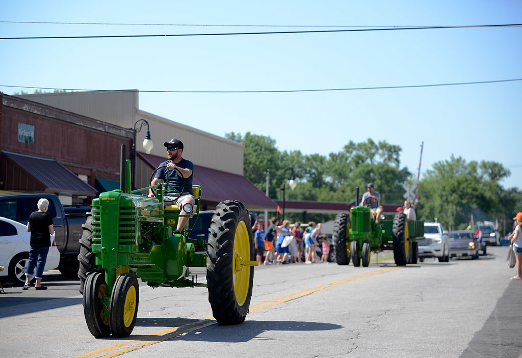People parade the streets of Sturgeon for the Boone County Fair